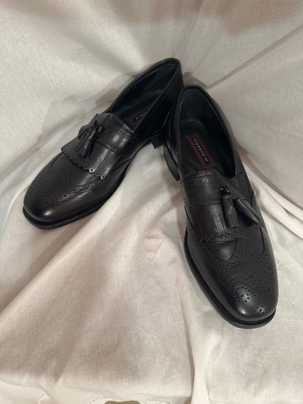 Florsheim 11, black loafers with a tassel
